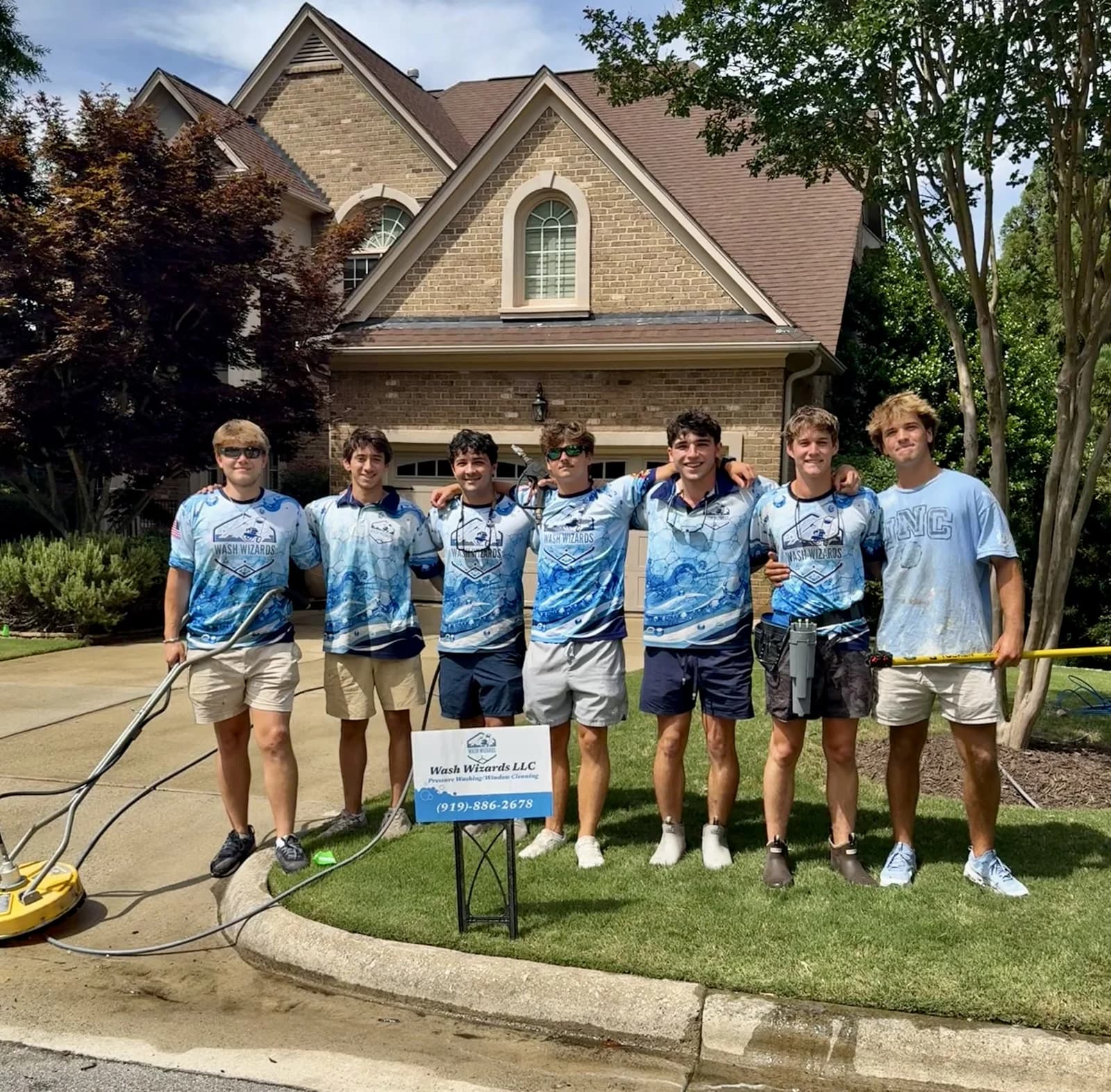 The Wash Wizards team in front of a completed job